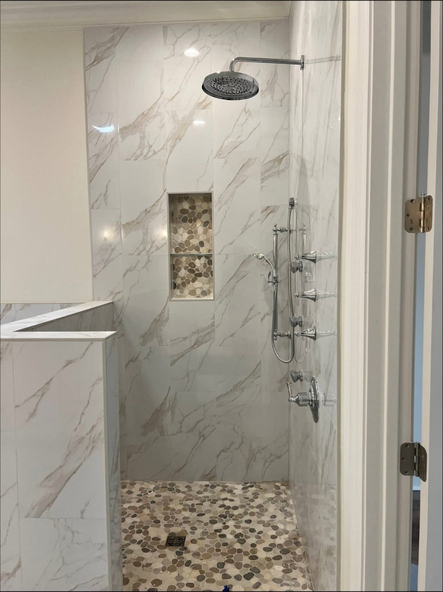 Yellow Fin Springfield primary bath walk-in shower with marble-look tile