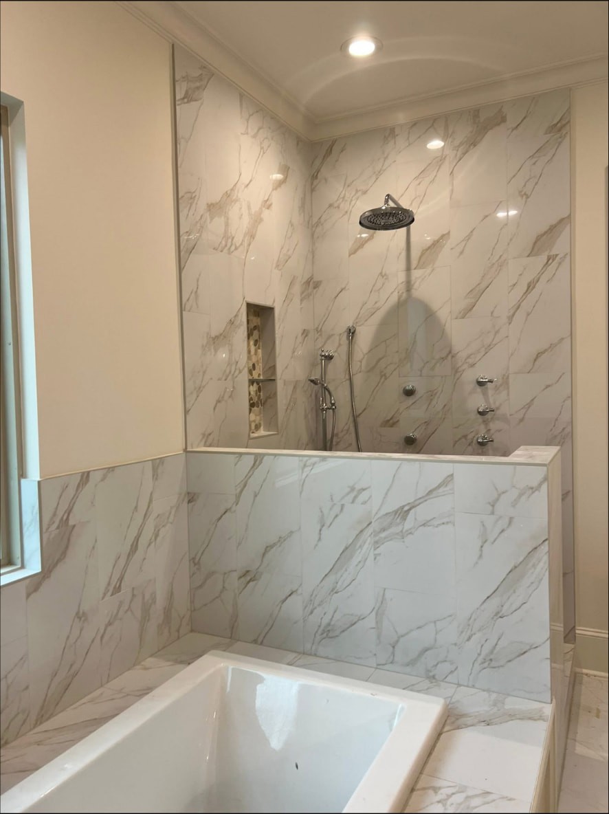 Yellow Fin Springfield primary bath with soaking tub and tiled half wall
