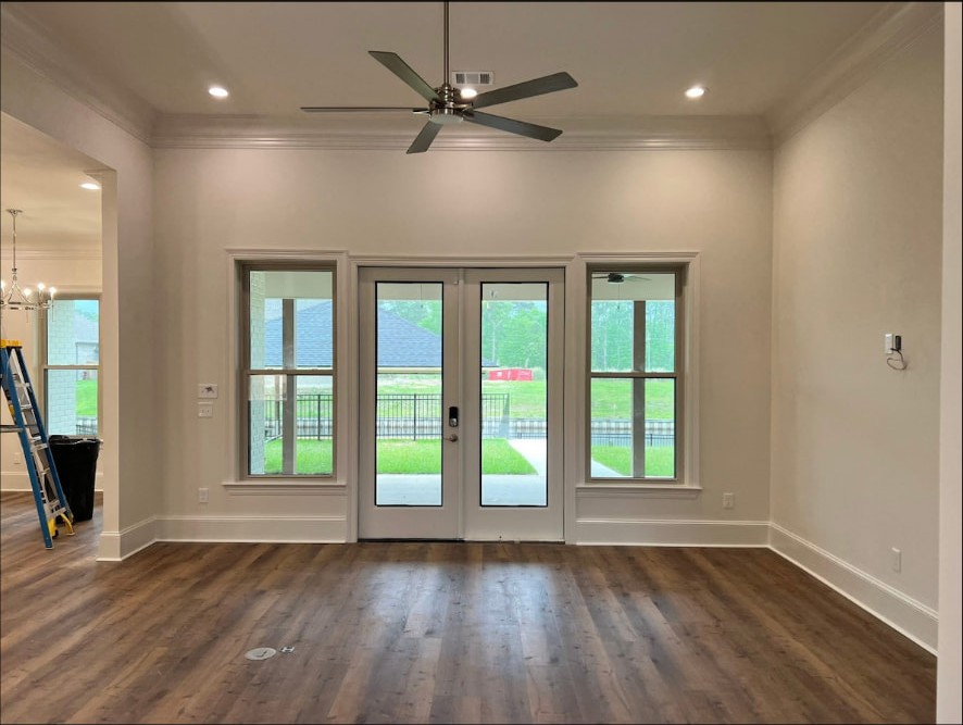 Yellow Fin Springfield living room with wood floors and ceiling fan