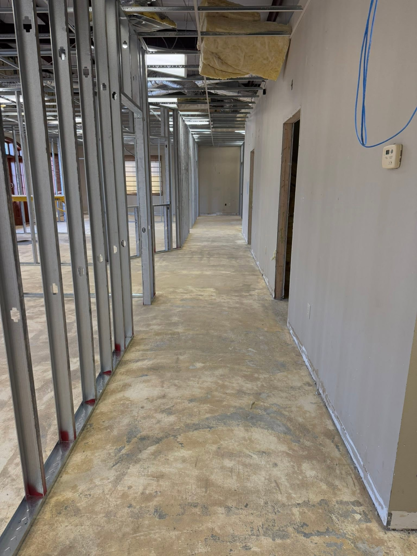 Audibel Jones Creek during construction — metal stud framing and open ceiling