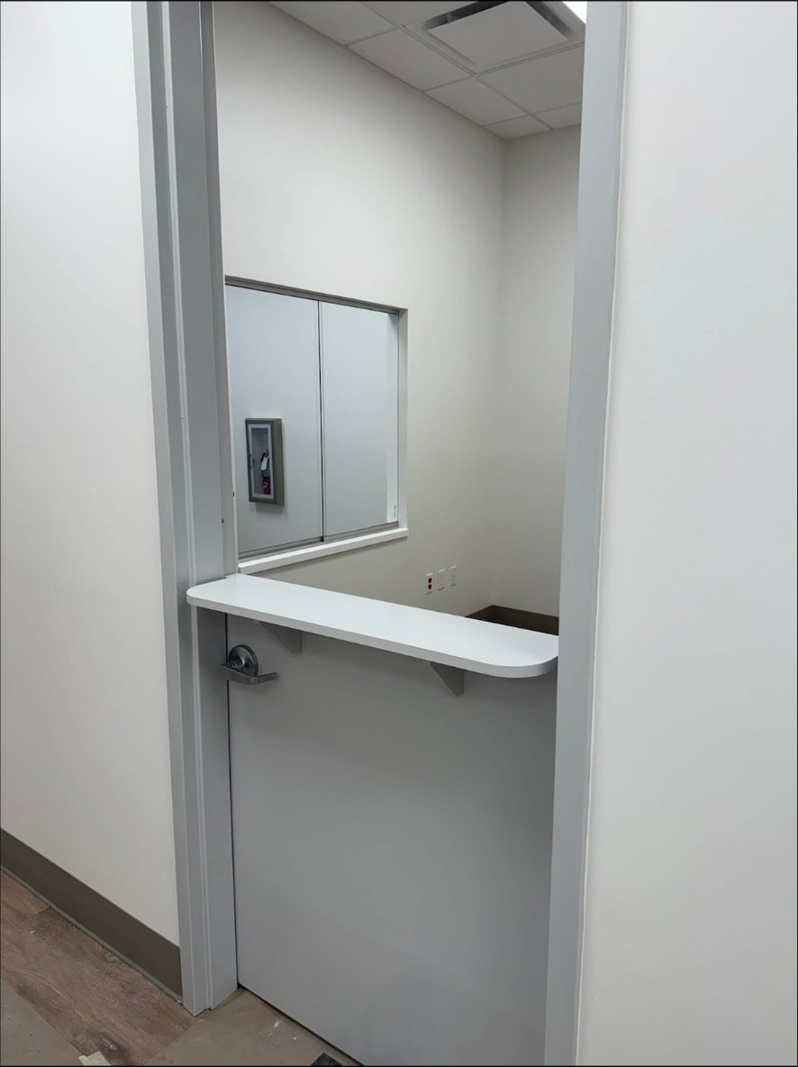 Reception transaction counter with glass slider and secure door