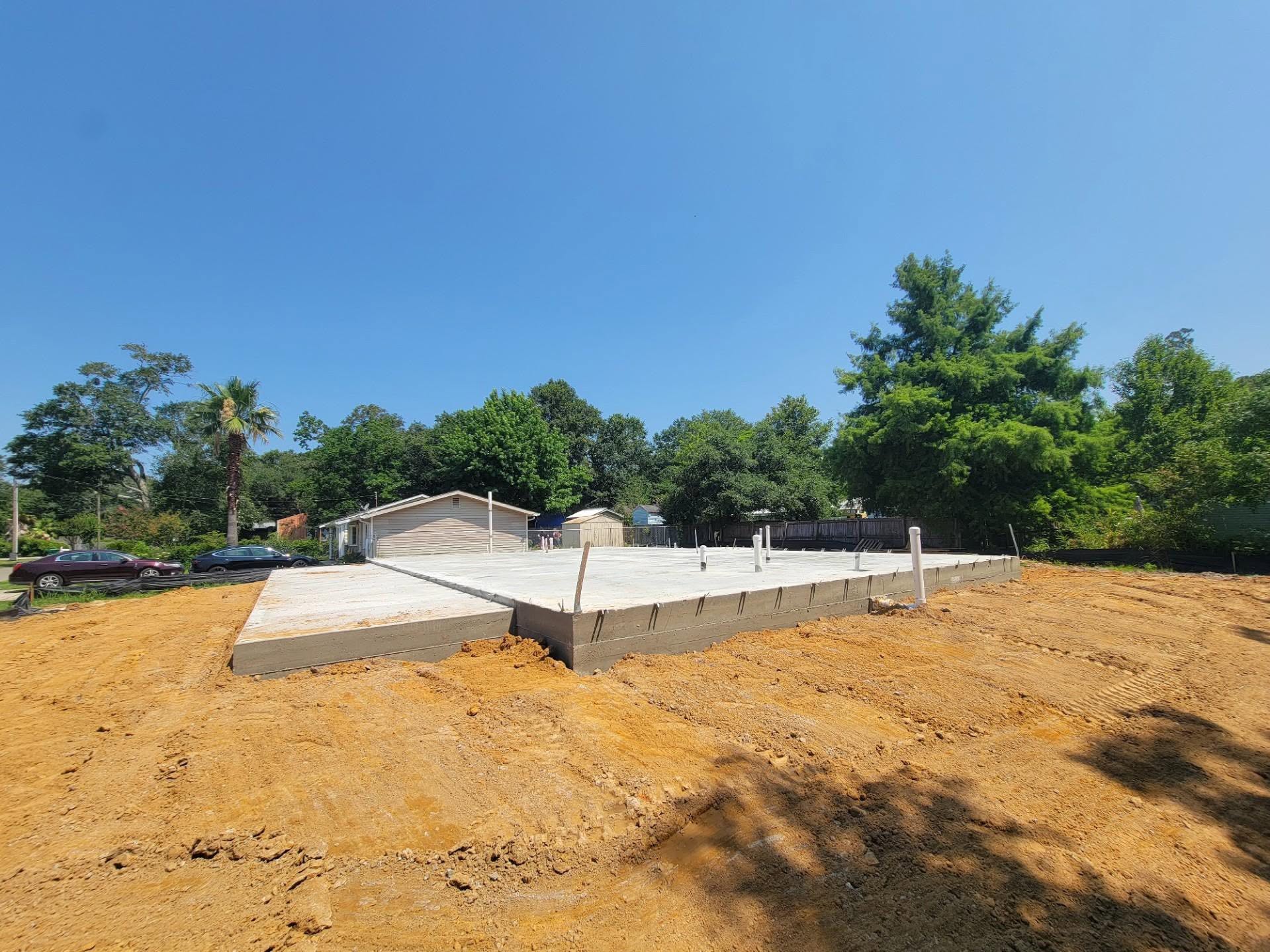 Waveland home under construction — poured slab foundation on graded site
